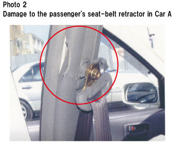 Photo 2  Damage to the passenger's seat-belt retractor in Car A